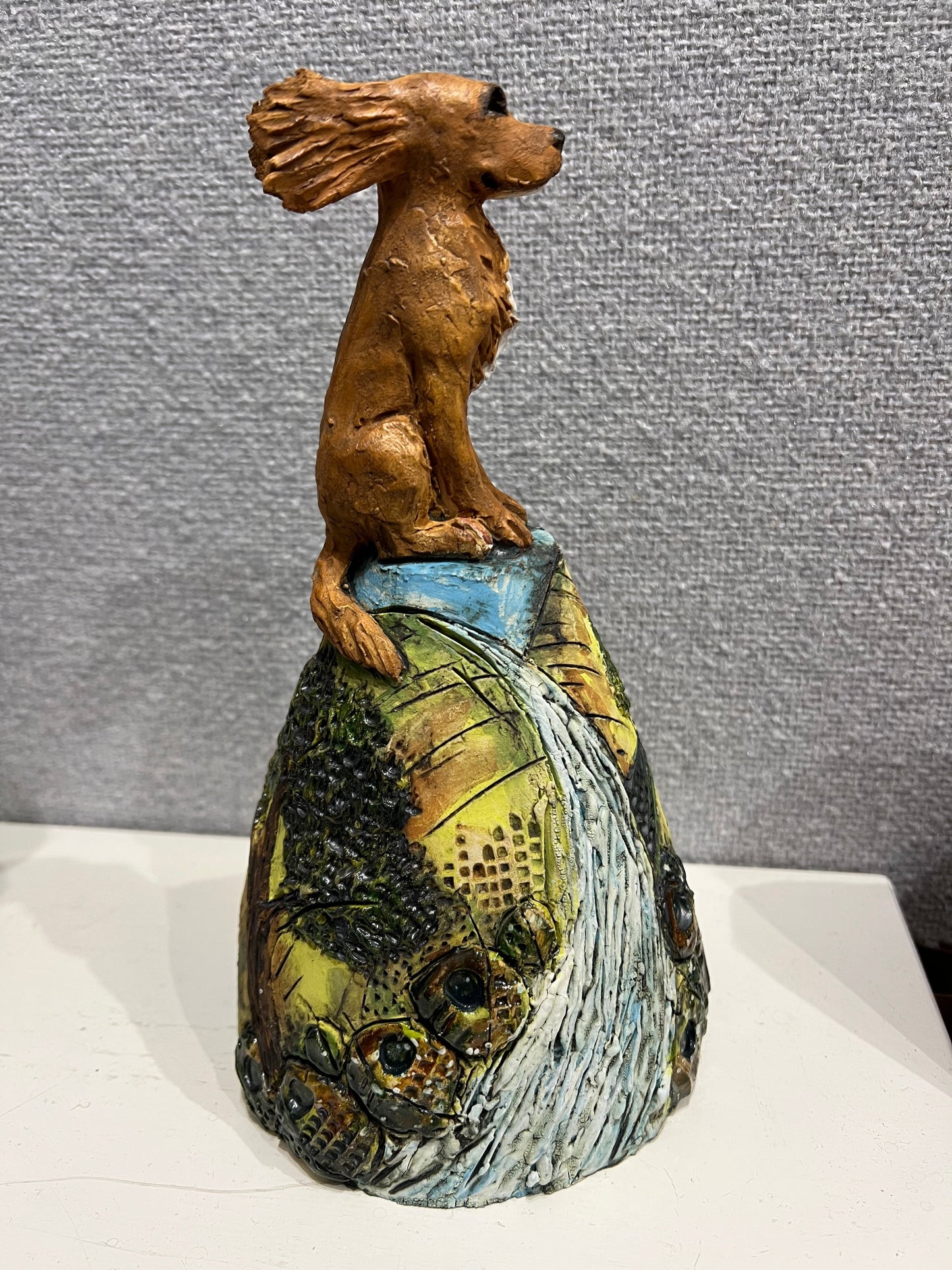 Hand painted ceramic sculpture of a spaniel on a hill by Christine Cummings Studio