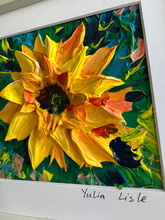Close up of a Small freestanding framed original oil painting featuring a richly textured sunflower in vibrant yellow and golden tones, created with expressive impasto paint by Yulia Lisle available at The Acorn Gallery in Pocklington. Shop online or call us on 01759 30652.