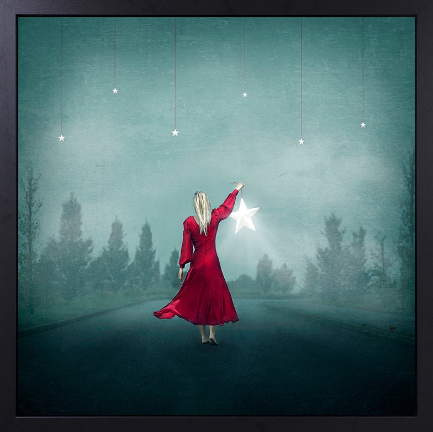 Beautiful image of a woman holding a star and looking at the night sky. Fallen star artwork by Michelle Mackie (Dolly) and available from The Acorn Gallery in Pocklington. Shop online or call us on 01759 307652.