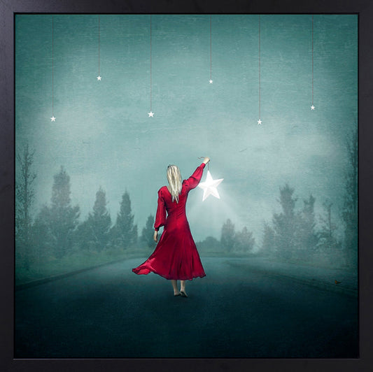 Beautiful image of a woman holding a star and looking at the night sky. Fallen star artwork by Michelle Mackie (Dolly) and available from The Acorn Gallery in Pocklington. Shop online or call us on 01759 307652.