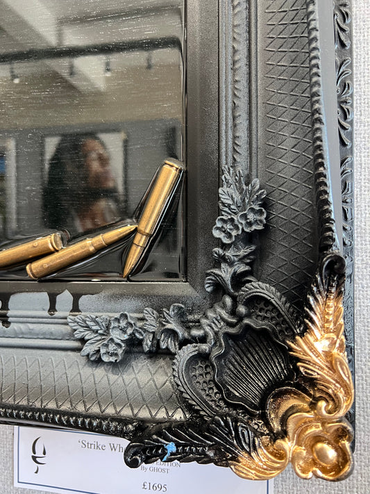 Artwork by Ghost featuring the Peaky Blinders character Tommy Shelby. It is titled Strike When Your Enemy Is Weak, and comes in a stunning black and gold ornate frame, embellished with shell casings! Shop at The Acorn Gallery, Pocklington. Buy online or call 01759 307652.