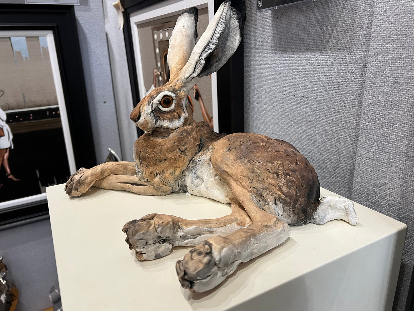 Lying Down Hare Paws Crossed ceramic sculpture by Louise Brown original artwork