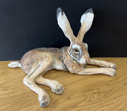 Beautiful lying down original hare sculpture by Louise Brown available from The Acorn Gallery in Pocklington. Order online or call us on 01759 307652.