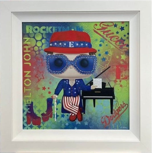 A brilliant Elton John Rocketman framed painting is by Lisa Holmes. Available now at The Acorn Gallery, Pocklington. Free UK Delivery. Visit Us or Shop Online Now. Or call us on 01759 307652.