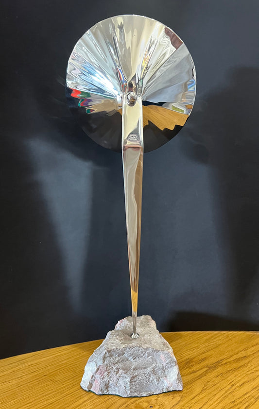 tall stainless steel sculpture mounted on a fine looking piece of rock. Sculpture by Lancastrian sculptor Malcolm Hull and available at The Acorn Gallery in Pocklington. Call 01759 307652.