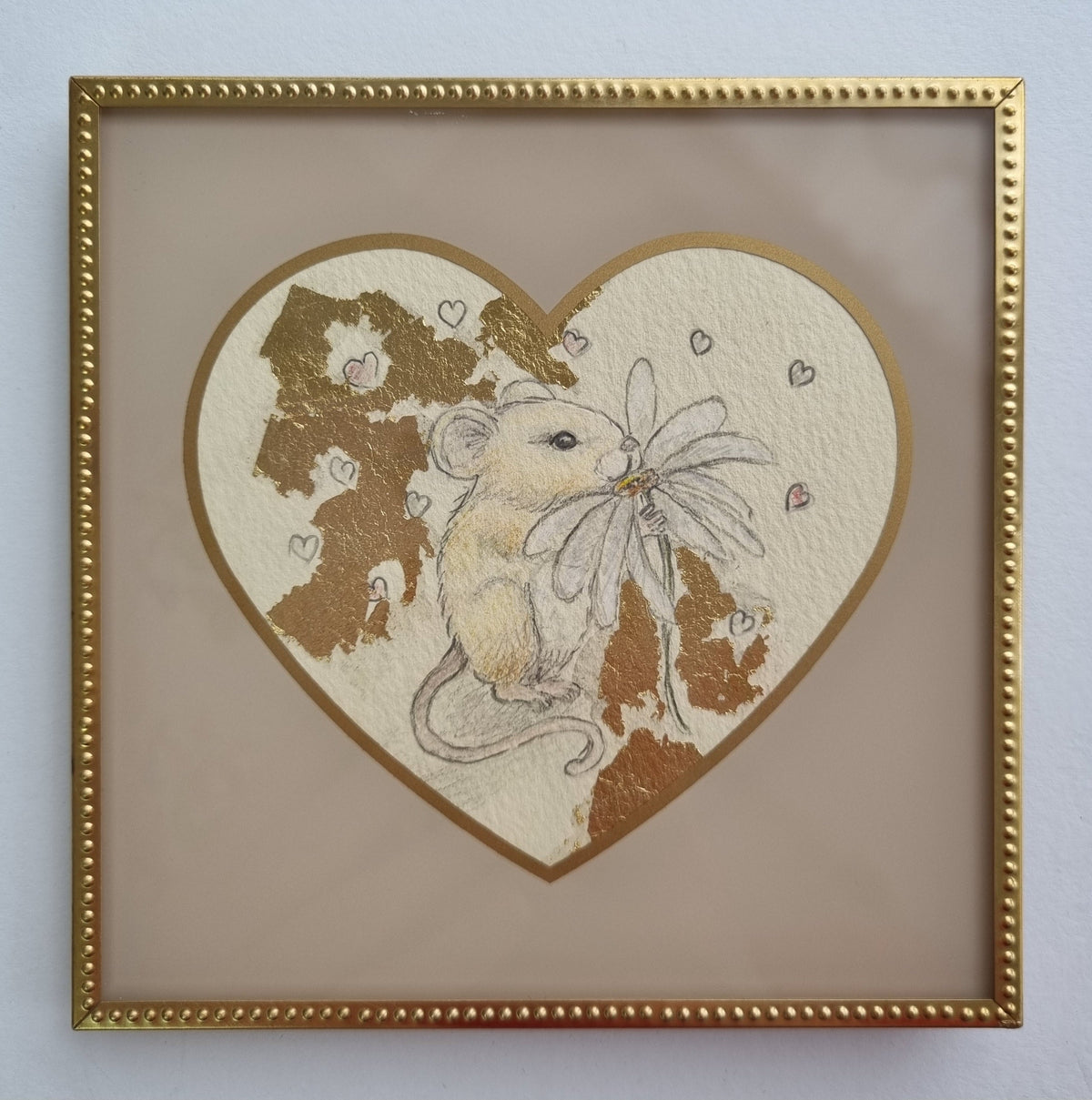 Original pencil sketch by Marie Louise Wrightson on a cream heart-shaped paper, with gold leaf, a rabbit and tiny hearts in a gold frame.