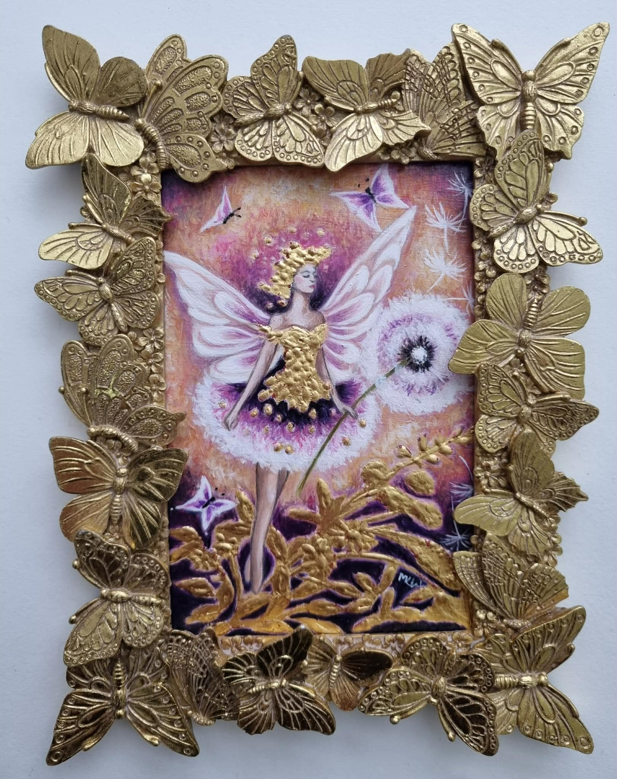 Original fairy artwork by Marie Louise Wrightson, featuring a pink and purple scene in a gold butterfly-embellished frame.