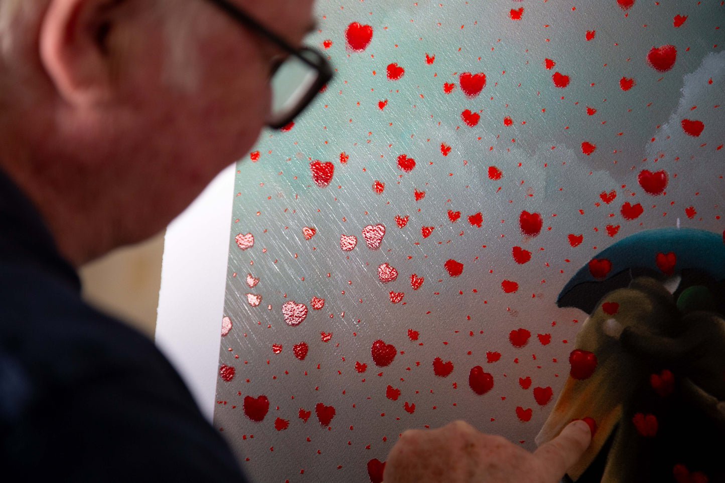 Remember When is a framed limited edition print by Middlesbrough artist Mackenzie Thorpe. It shows a couple under an umbrella walking theough a shower of falling love hearts. Available at The Acorn Gallery in Pocklington with free UK delivery. Shop online or call us on 01759 307652.