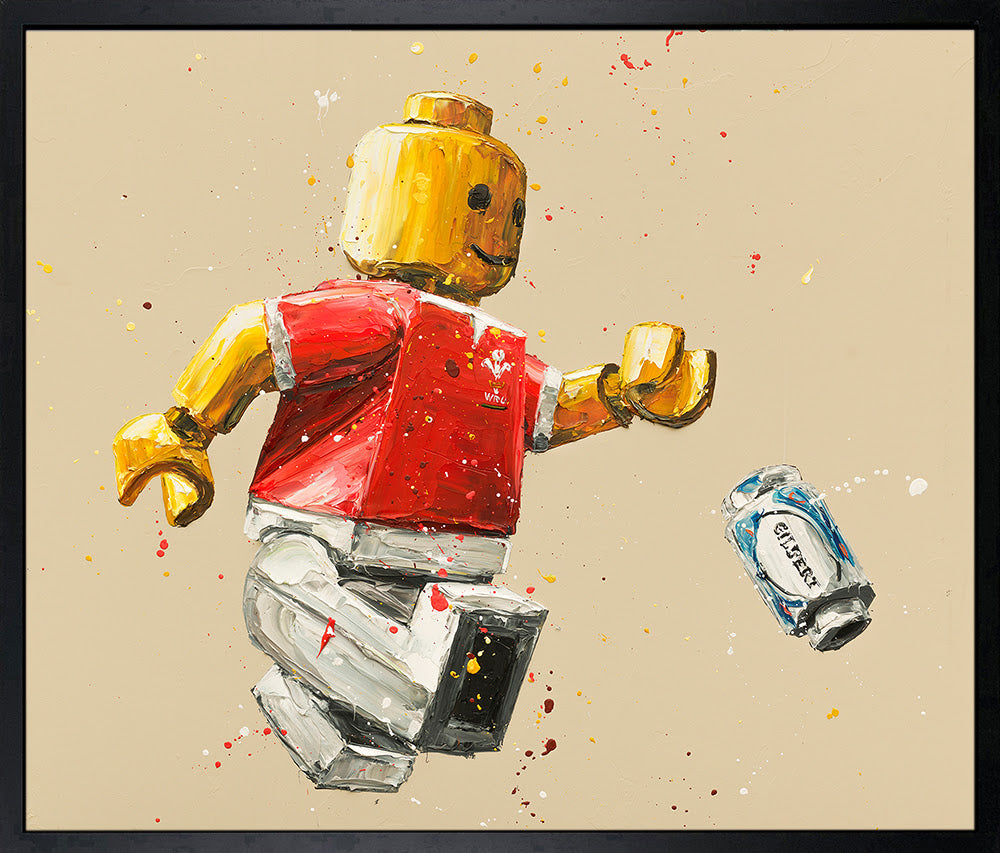 Hand-embellished canvas print by Paul Oz, featuring a red-and-yellow Lego rugby player and a floating can.