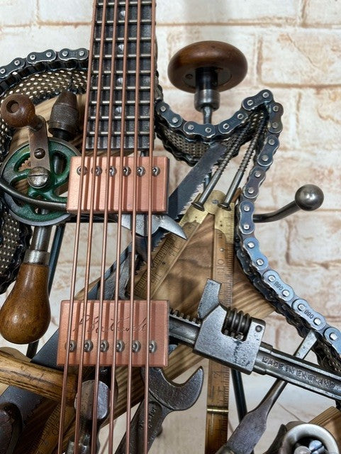 Discover Dad's Old Shed by Paul Southwell, a handmade Les Paul-inspired metal guitar sculpture created using old tools. Available at The Acorn Gallery, Pocklington