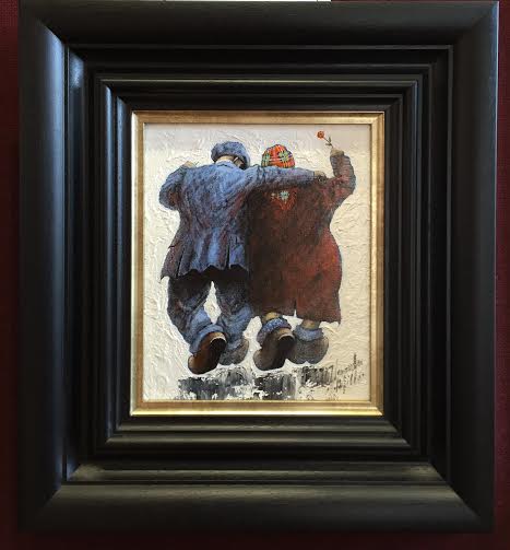 Original oil on board painting "Love Is..." by Alexander Millar depicting a couple embracing, framed in black and gold.