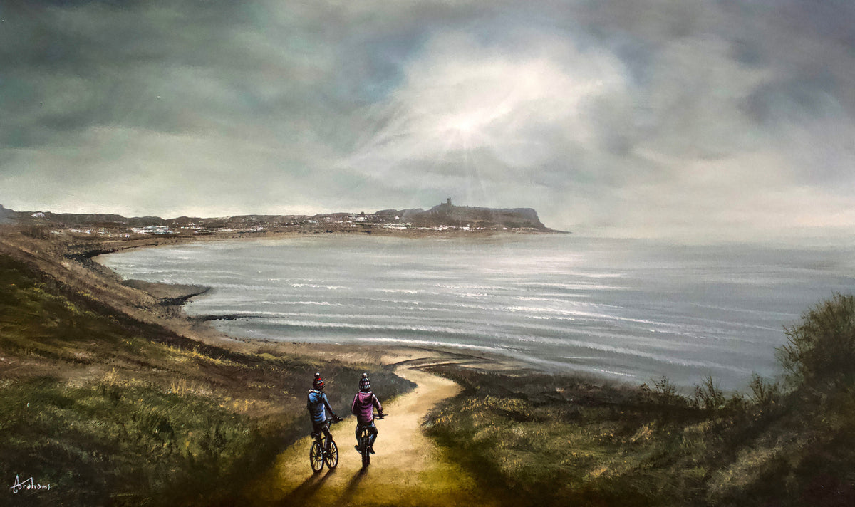 Original oil painting by Danny Abrahams, with two cyclists on a sandy coastal path overlooking a grey sea and headland.