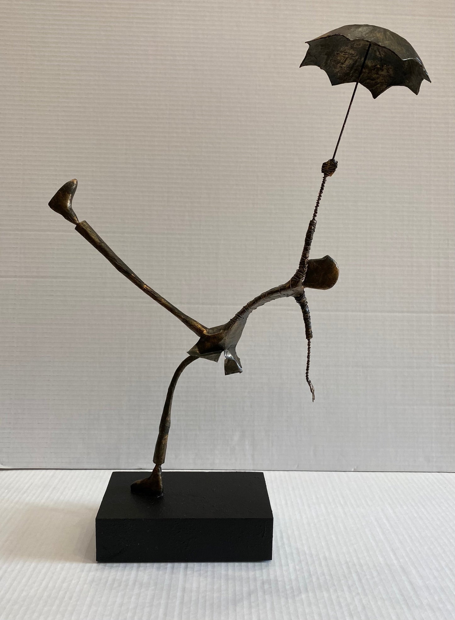 Original Ed Rust sculpture Windy Day mixed media figure with umbrella on black base
