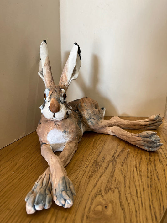 A chilled out laid back hare hand made by artist Louise Brown at The Acorn Gallery in Pocklington. Visit us or shop online. Safe UK delivery. Or call us 01759 307652