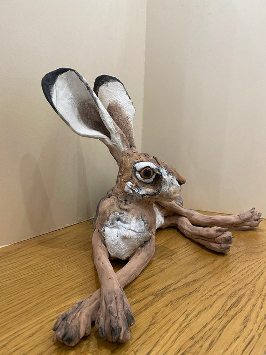 A chilled out laid back hare hand made by artist Louise Brown at The Acorn Gallery in Pocklington. Visit us or shop online. Safe UK delivery. Or call us 01759 307652