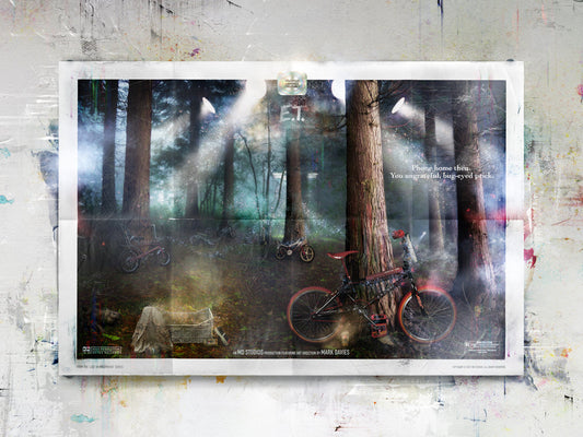 Limited edition Mark Davies print featuring E.T. scene with bikes and glowing spaceship in dark forest ambiance