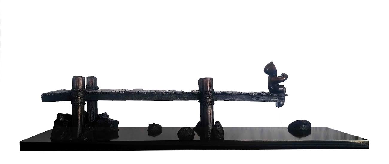 Bronze limited edition sculpture "On The Dock Of The Bay" by Mackenzie Thorpe showing a figure sitting on a dock edge on a black base