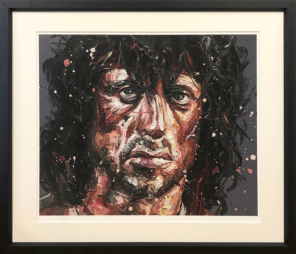Paper print by Paul Oz featuring a bold, expressive portrait of Rambo in dark, splattered brushstrokes.
