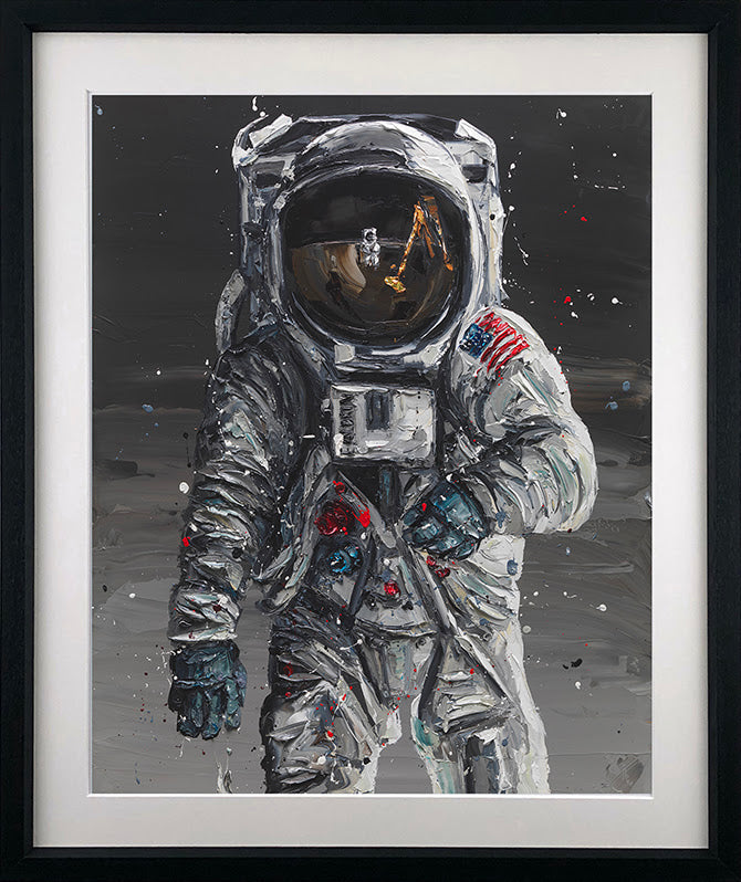 Astronaut art print by Paul Oz, with a textured silver spacesuit, American flag patch and dark lunar backdrop.