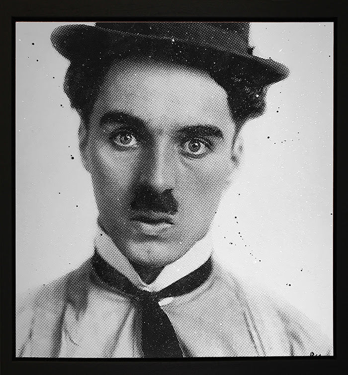 Canvas print by Paul Oz, black-and-white halftone portrait of Charlie Chaplin as the Little Tramp with a bowler hat and tie.
