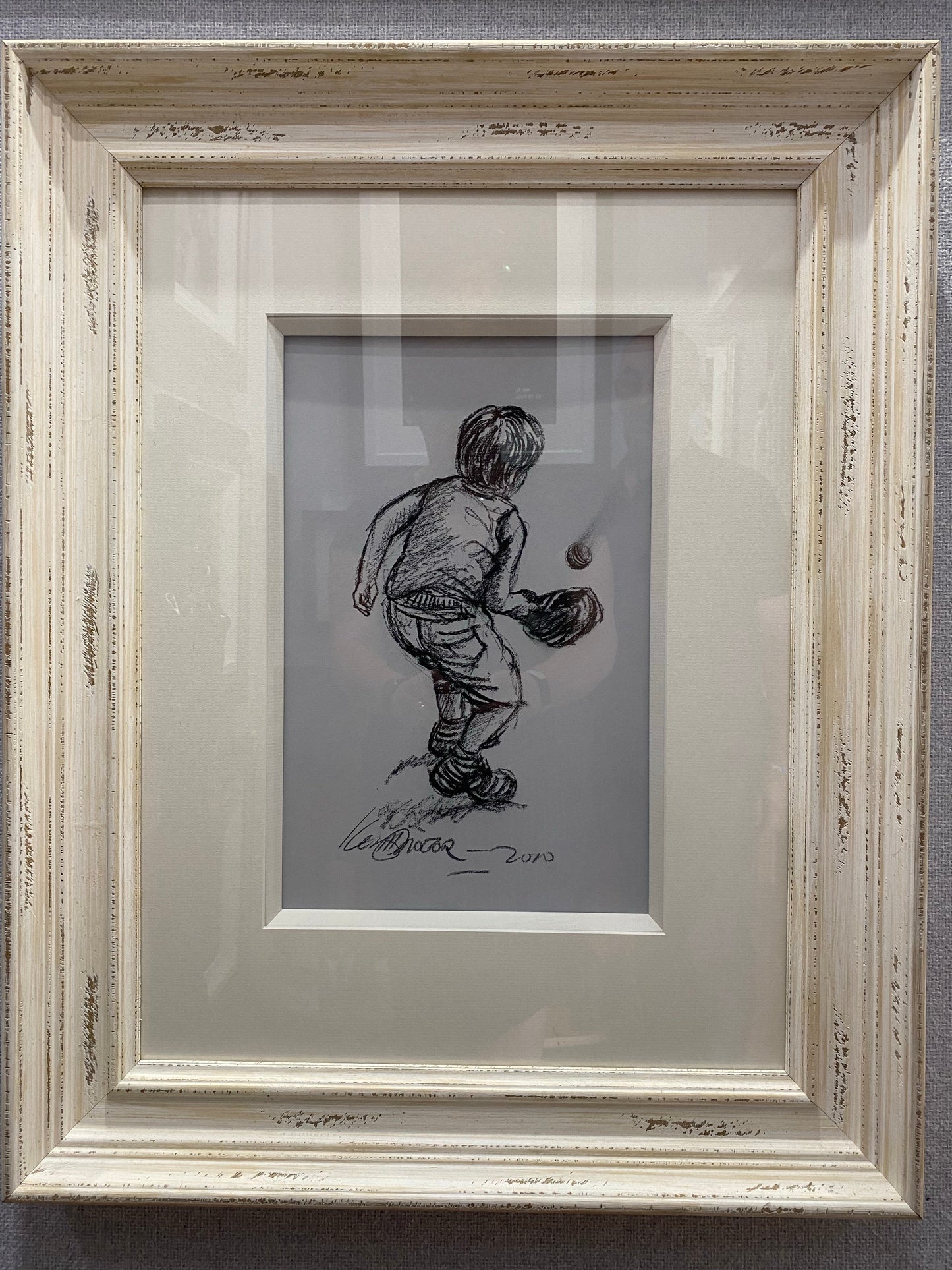 Keith Proctor original charcoal sketch of child playing cricket in vintage cream frame