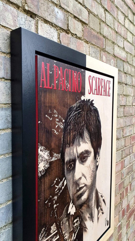 Original mixed media artwork Tony Montana by Rob Bishop framed and signed, displayed against a brick wall