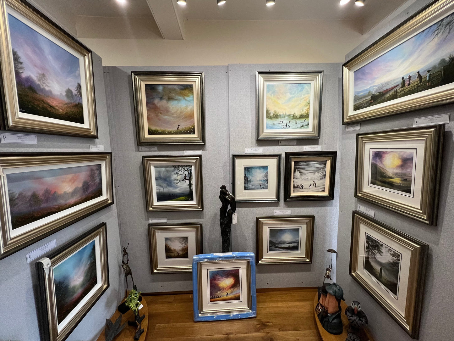 Gallery display of framed limited edition prints by Danny Abrahams including "Brrr! Its Been A Cold One Today" in various landscape scenes
