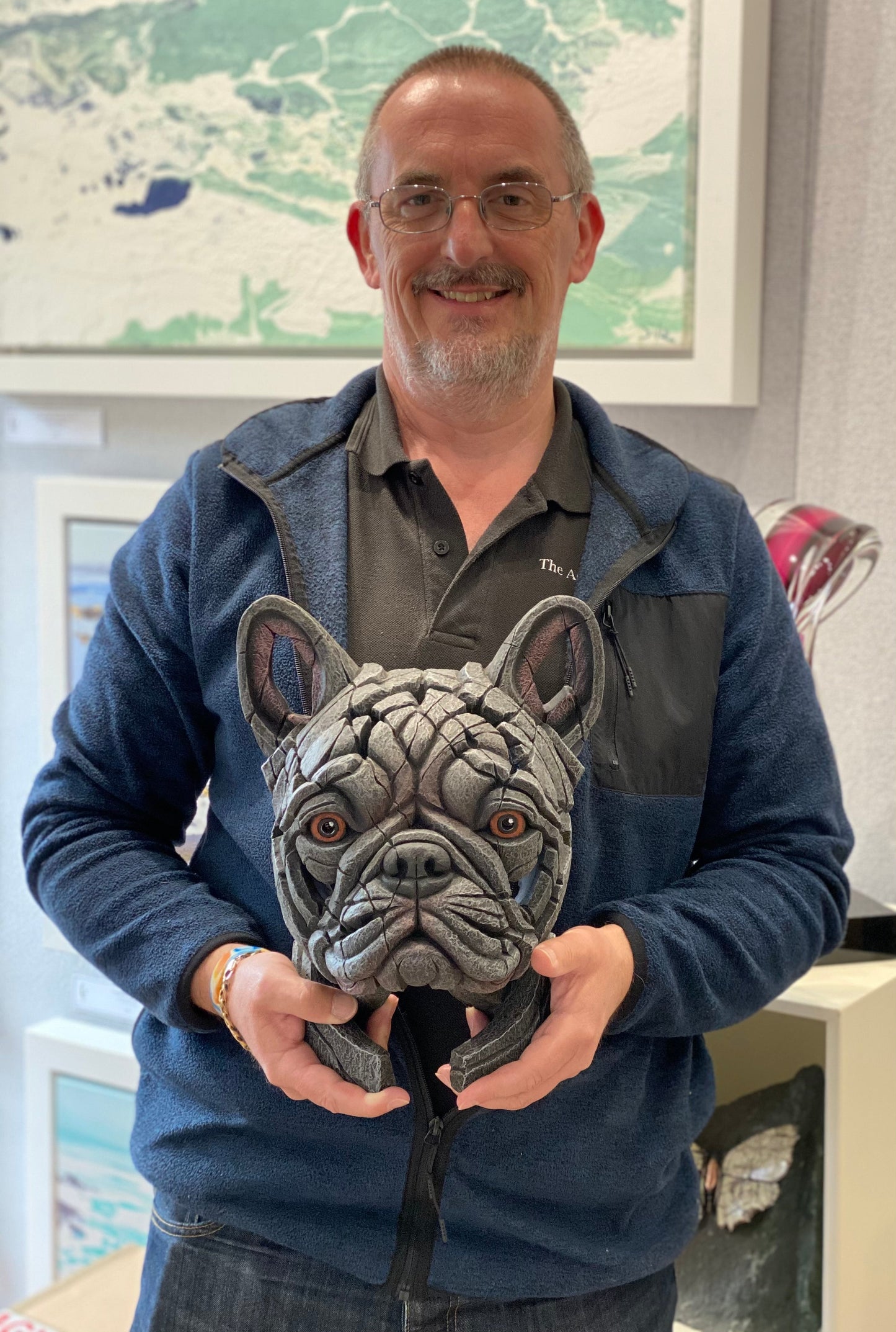 Man holding Edge Sculpture French Bulldog Blue ceramic polystone sculpture handcrafted and hand signed by the artist