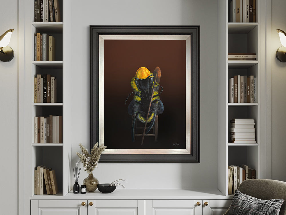 Come The Revolution Original painting shows a worker bee wearing a yellow hard hat and holding a shovel. The worker bee is sitting on a wooden stool. Artwork by Angus Gardner and available at The Acorn Gallery, Pocklington.