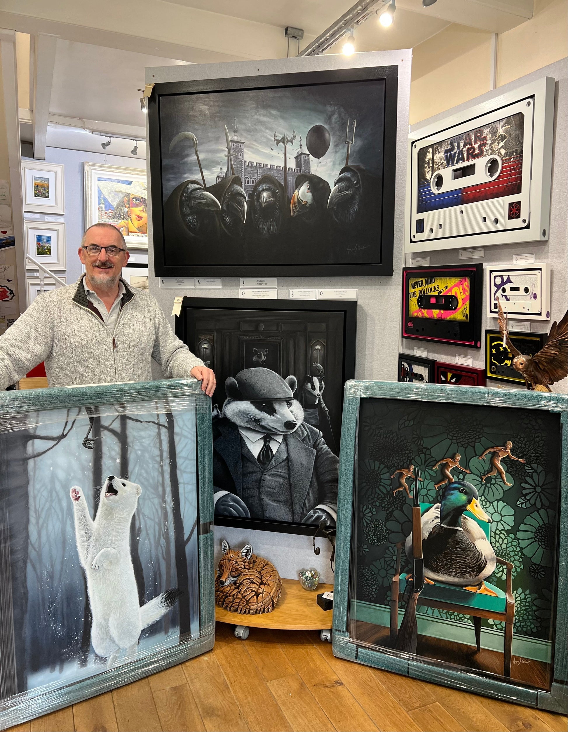 John at The Acorn Gallery in Pocklington showing off four framed original paintings by Yorkshire wildlife artist Angus Gardner. Shop online or call us on 01759 307652. UK delivery. 