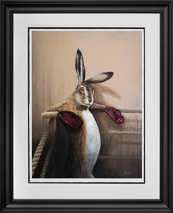 Angus Gardner Marciano the hare who is wearing boxing gloves and standing in a boxing ring. Framed print from The Acorn Gallery, Pocklington