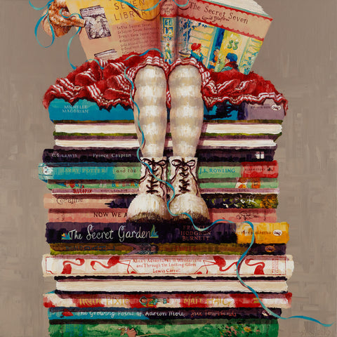 Painting by artist Amanda Stratford showing a little girl sat reading. She is sitting on a stack of books. Painting and prints available from The Acorn Gallery, Pocklington with delivery.