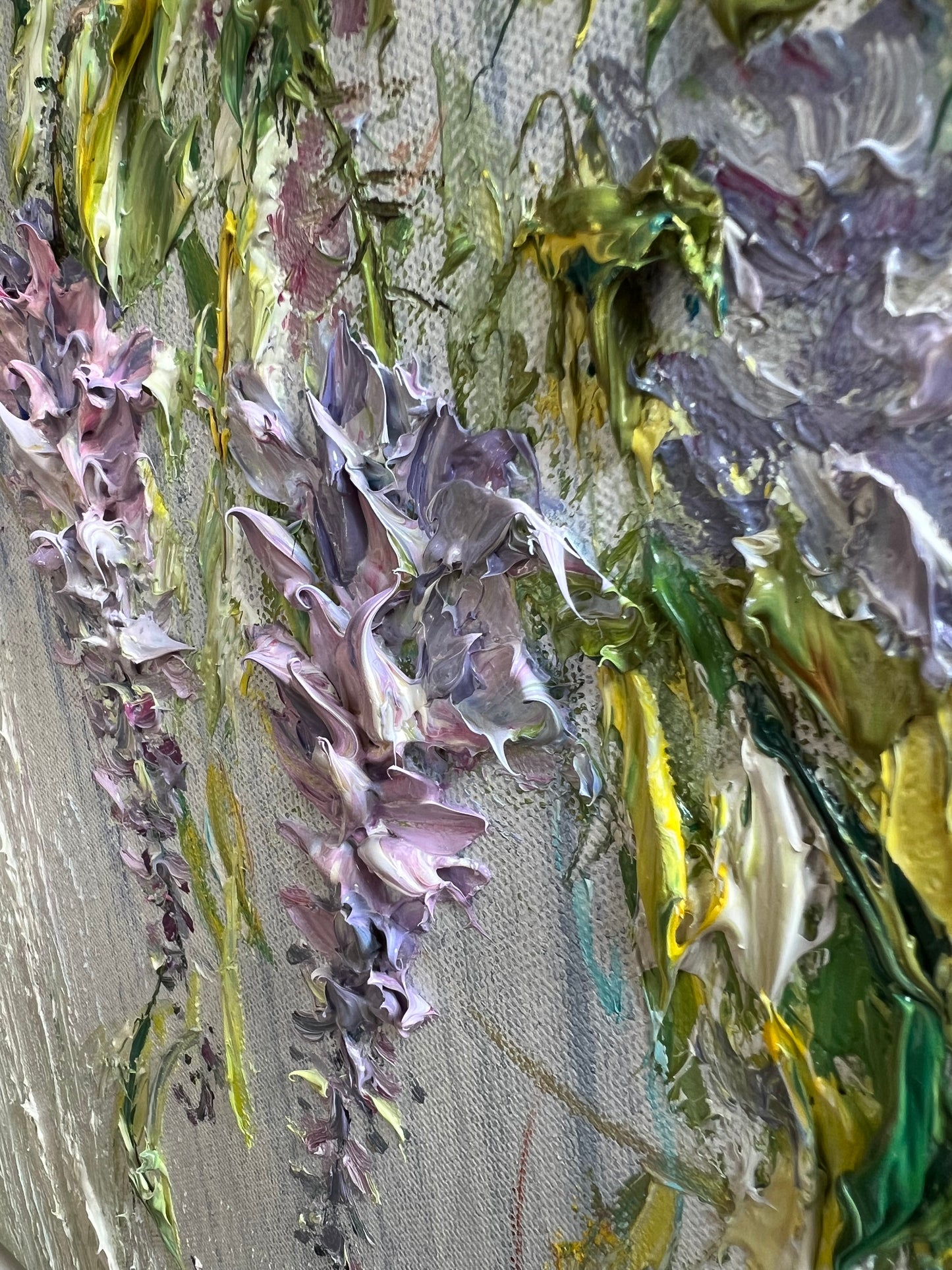 Original textured painting of delicate lilac Wisteria blossoms against a soft background with vibrant greenery, created with expressive impasto brushwork by Yulia Lisle. Painting available from The Acorn Gallery in Pocklington. Visit us or Shop online or Call 01759 307652. 
