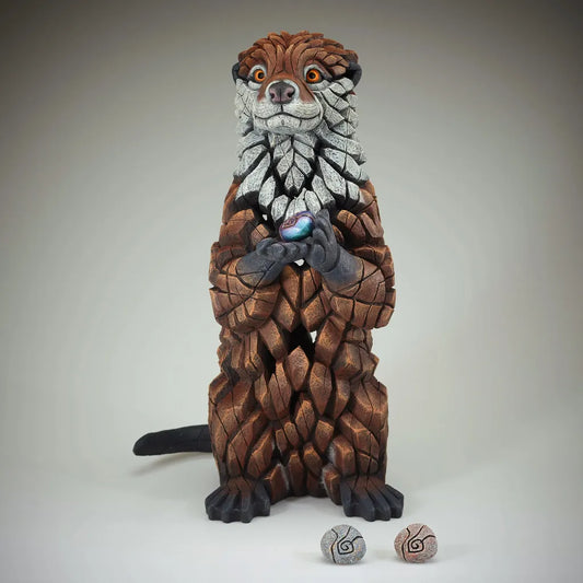 Edge Sculpture Pebbles the Otter holding a pebble. Available from The Acorn Gallery, Pocklington