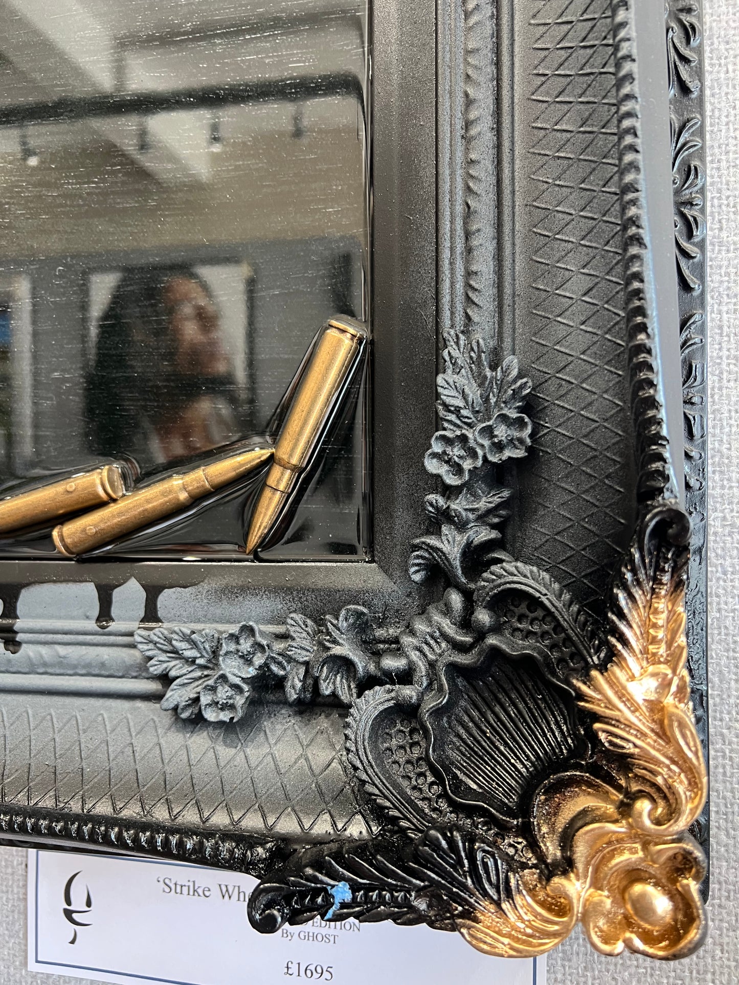 Artwork by Ghost featuring the Peaky Blinders character Tommy Shelby. It is titled Strike When Your Enemy Is Weak, and comes in a stunning black and gold ornate frame, embellished with shell casings! Shop at The Acorn Gallery, Pocklington. Buy online or call 01759 307652.