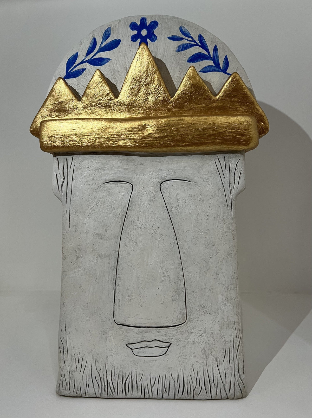 Feast Boldly original ceramic Bighead sculpture by Jenny Mackenzie with gold crown and blue decoration.