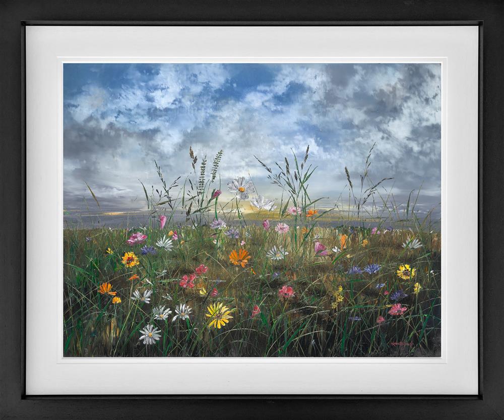 Framed artwork of a field with wildflowers and a cloudy sky. Kimberley Harris Dawn To Dusk Hand Embellished Canvas Framed - The Acorn Gallery, Pocklington