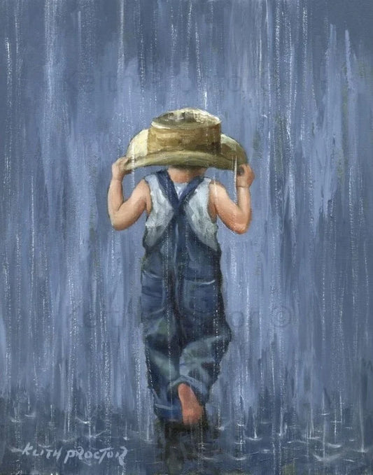Looks Like Rain hand embellished canvas board by Keith Proctor showing a young boy in denim dungarees holding a straw hat as he walks through pouring rain.