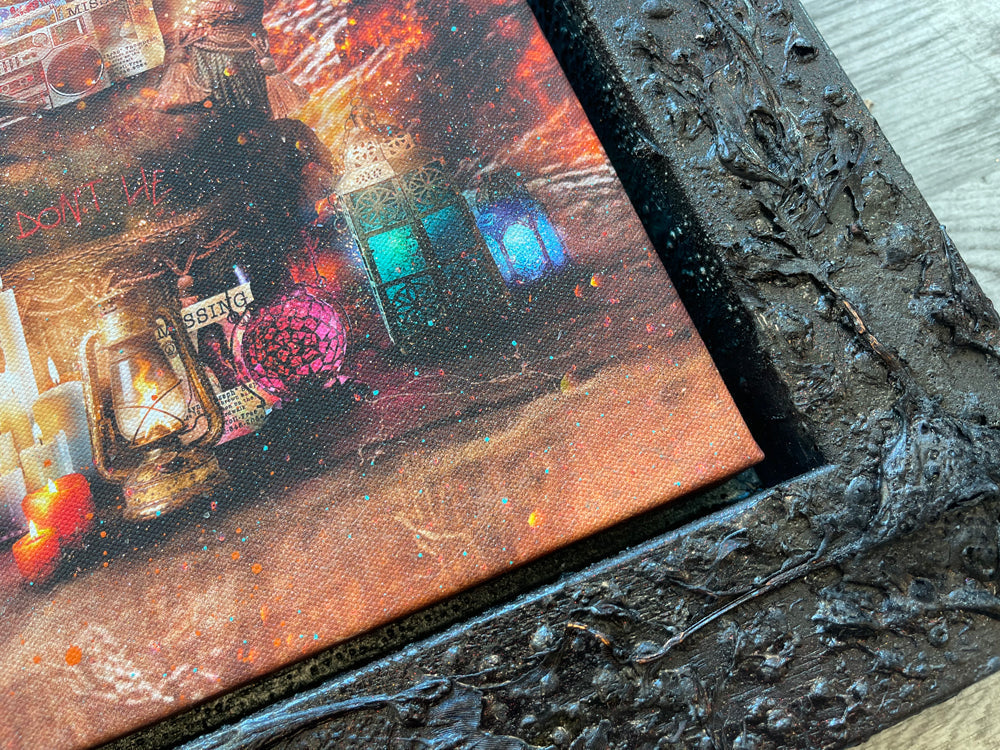 Mixed media canvas artwork by Mark Davies, depicting a fiery cavern with a moonlit sky, chandelier and vivid green accents, in a dark ornate frame.