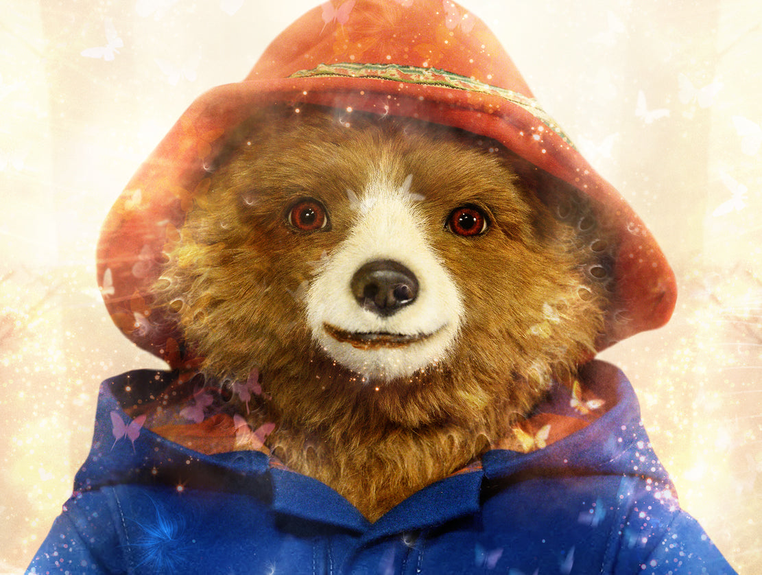 Limited edition print by Mark Davies, colourful Paddington bear in a blue coat among flowers with two corgis and a dove.