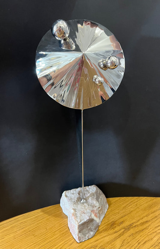 tall stainless steel sculpture of a radar like structure with stainless steel balls attached and mounted on a fine looking piece of rock. Sculpture by Lancastrian sculptor Malcolm Hull and available at The Acorn Gallery in Pocklington. Call 01759 307652.