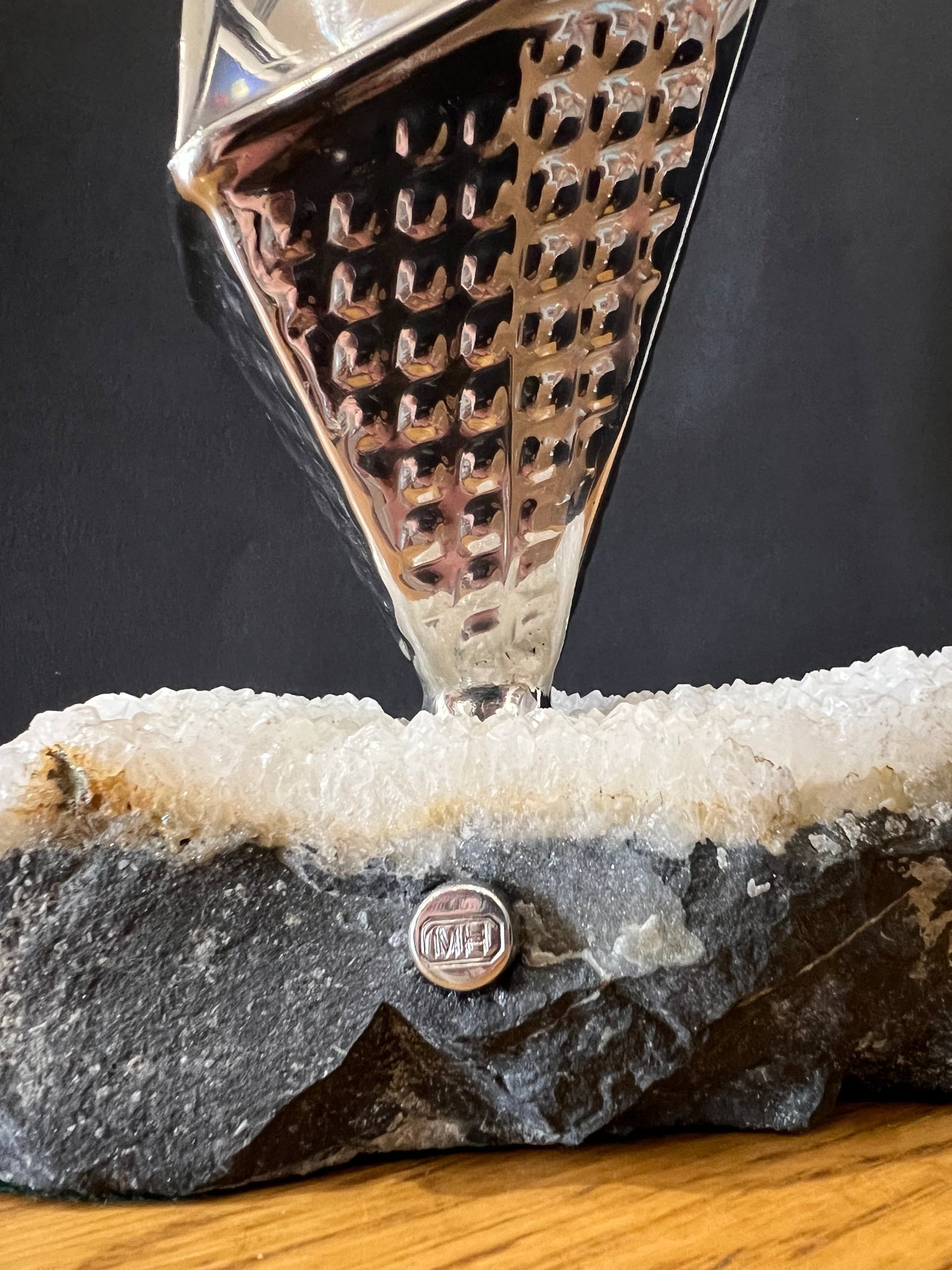 tall stainless steel obelisk mounted on a fine looking piece of rock. Sculpture by Lancastrian sculptor Malcolm Hull and available at The Acorn Gallery in Pocklington. Call 01759 307652.