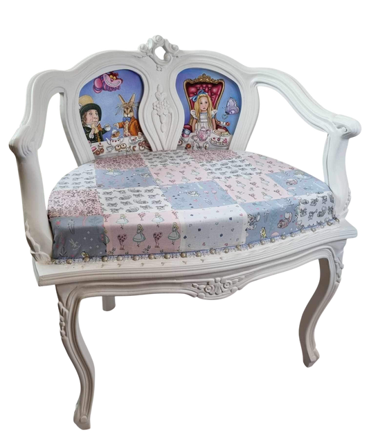 A full sized adults chair hand painted with scenes from Alice in Wonderland by artist Marie Louise Wrightson.
