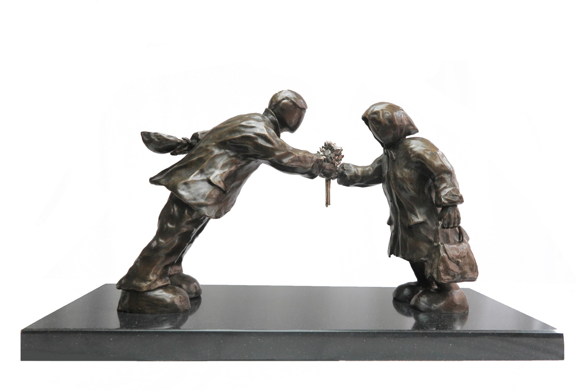 Bronze sculpture of a man leaning towards a lady handing her a bunch of flowers. Sculpture Leaning in for love by Mackenzie Thorpe at The Acorn Gallery in Pocklington. Call 01759 307652.