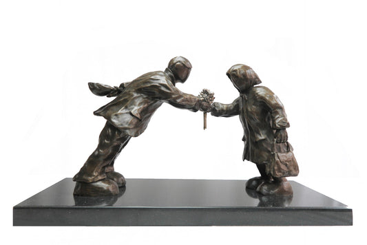 Bronze sculpture of a man leaning towards a lady handing her a bunch of flowers. Sculpture Leaning in for love by Mackenzie Thorpe at The Acorn Gallery in Pocklington. Call 01759 307652.
