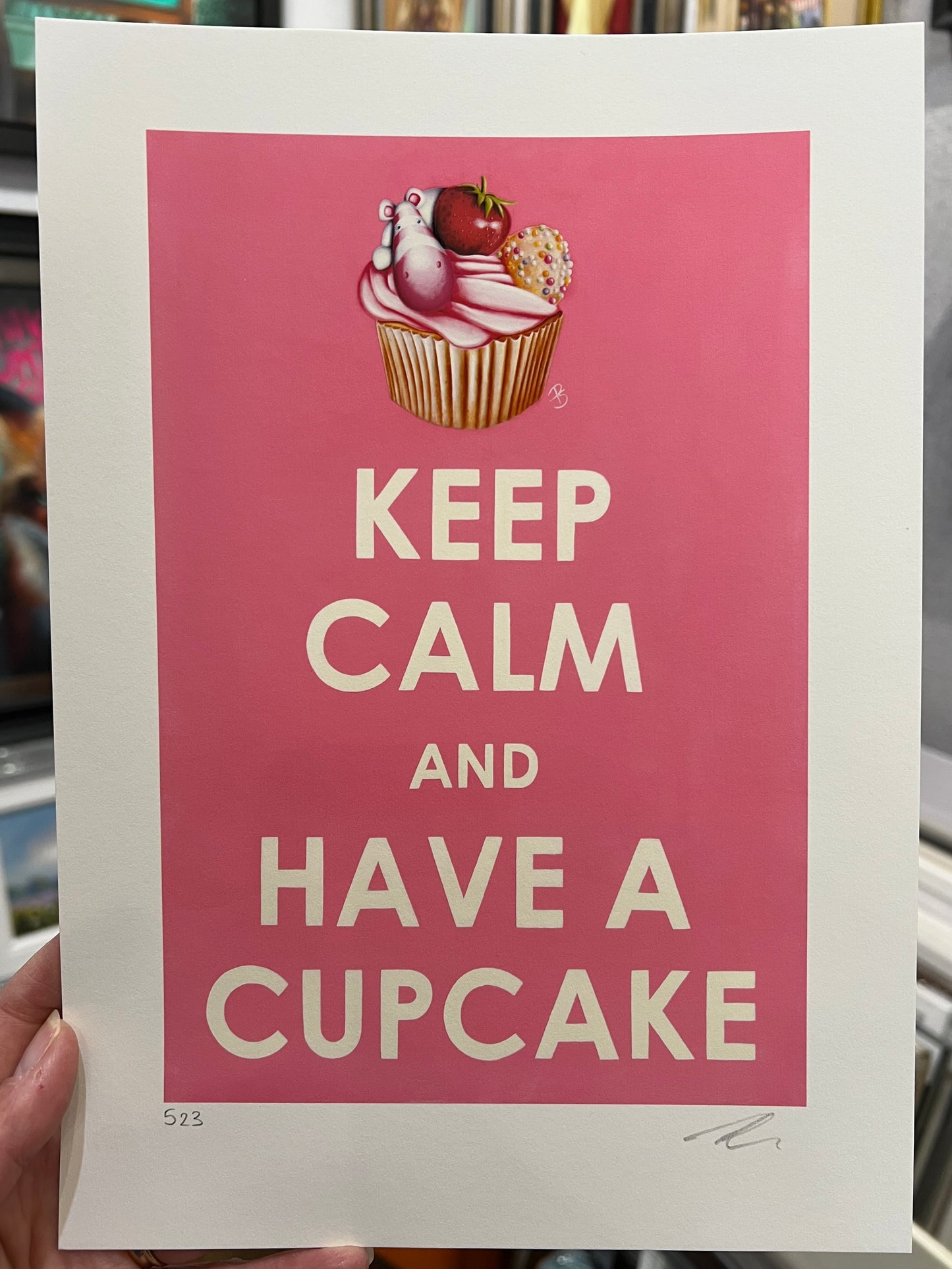 Limited Edition paper print with 'Keep Calm and Have a Cupcake' text and cupcake illustration on pink background by artist Peter Smith. Shop at The Acorn Gallery.