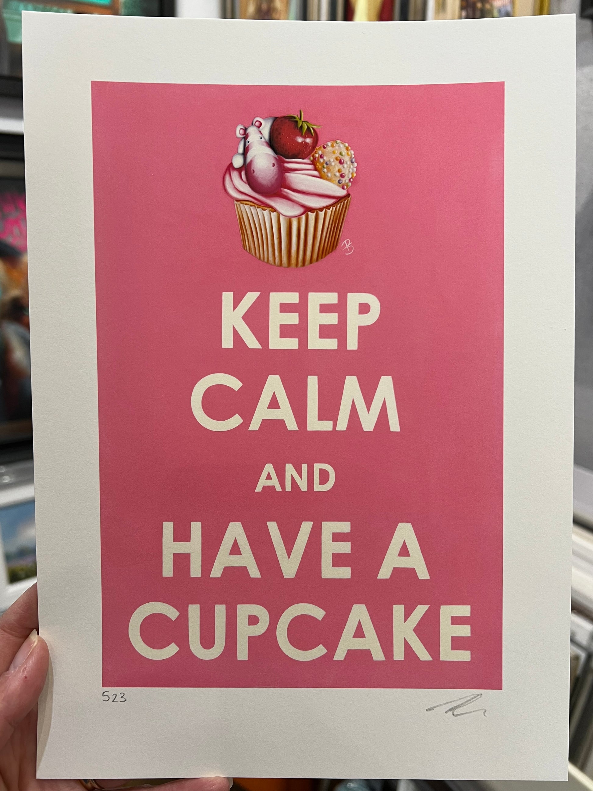 Limited Edition paper print with 'Keep Calm and Have a Cupcake' text and cupcake illustration on pink background by artist Peter Smith. Shop at The Acorn Gallery.