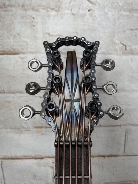 Colours Union Jack metal guitar sculpture by Paul Southwell, inspired by a Gibson Les Paul with heat-tempered iridescent metal and wood detailing