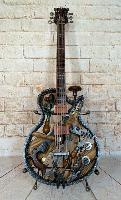 Discover Dad's Old Shed by Paul Southwell, a handmade Les Paul-inspired metal guitar sculpture created using old tools. Available at The Acorn Gallery, Pocklington