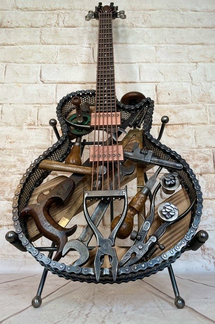 Discover Dad's Old Shed by Paul Southwell, a handmade Les Paul-inspired metal guitar sculpture created using old tools. Available at The Acorn Gallery, Pocklington